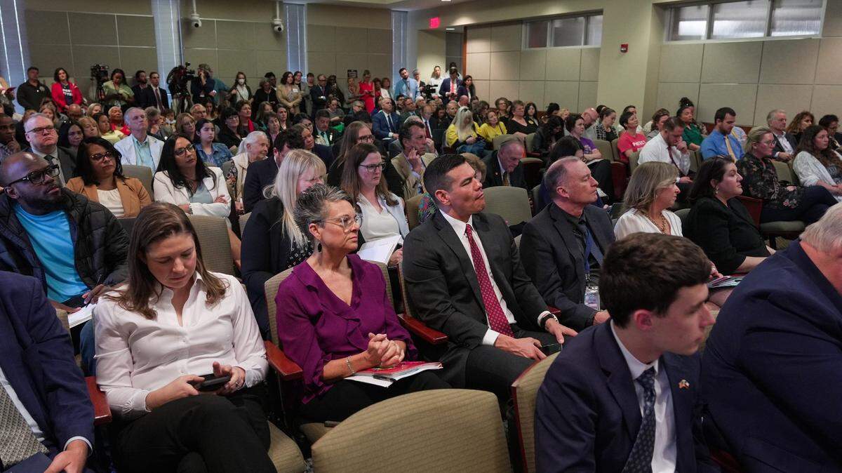 People look on as members of the Texas House Public Education Committee speak at a packed public hearing on school vouchers held on Tuesday morning, March 11, 2025.