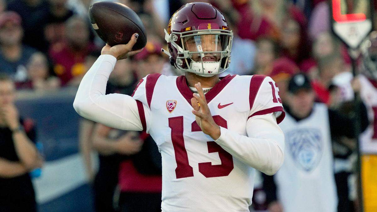 Southern California quarterback Caleb Williams passes the ball against Arizona in the first half during an NCAA college football game, Saturday, Oct. 29, 2022, in Tucson, Ariz. (AP Photo/Rick Scuteri)