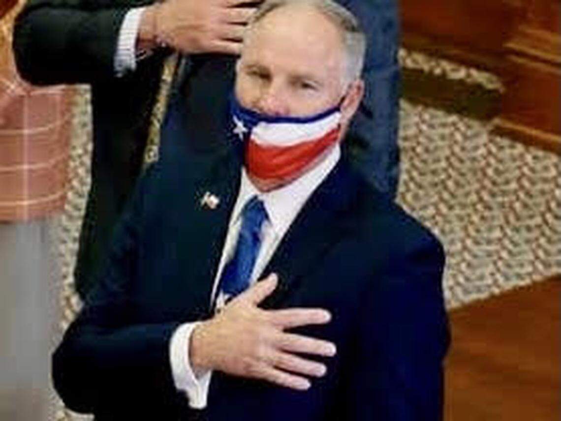 State Rep. Kyle Biedermann, R-Fredericksburg, pledges allegiance to the U.S. flag in the Texas House.