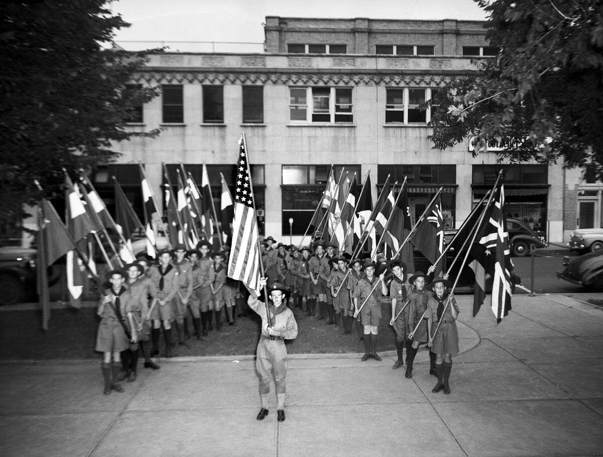 June 14, 1942: “These flags of the Allied Nations, borne by Boy Scouts, shared honors with ‘Old Glory’ Sunday evening at Elks’ Lodge-American Legion ceremonies at Burnett Park, which brought to a dramatic close the city’s first observance of a wartime Flag Day in 24 years.”