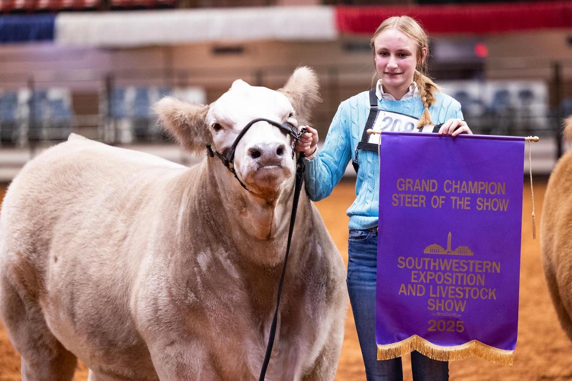 La Vernia resident Mattison Koepp, 16, takes a photo after her steer won Grand Champion Steer of the Show at the Fort Worth Stock Show & Rodeo on Friday, Feb. 7, 2025. Koepp took home the Reserve champion award in last year’s event.