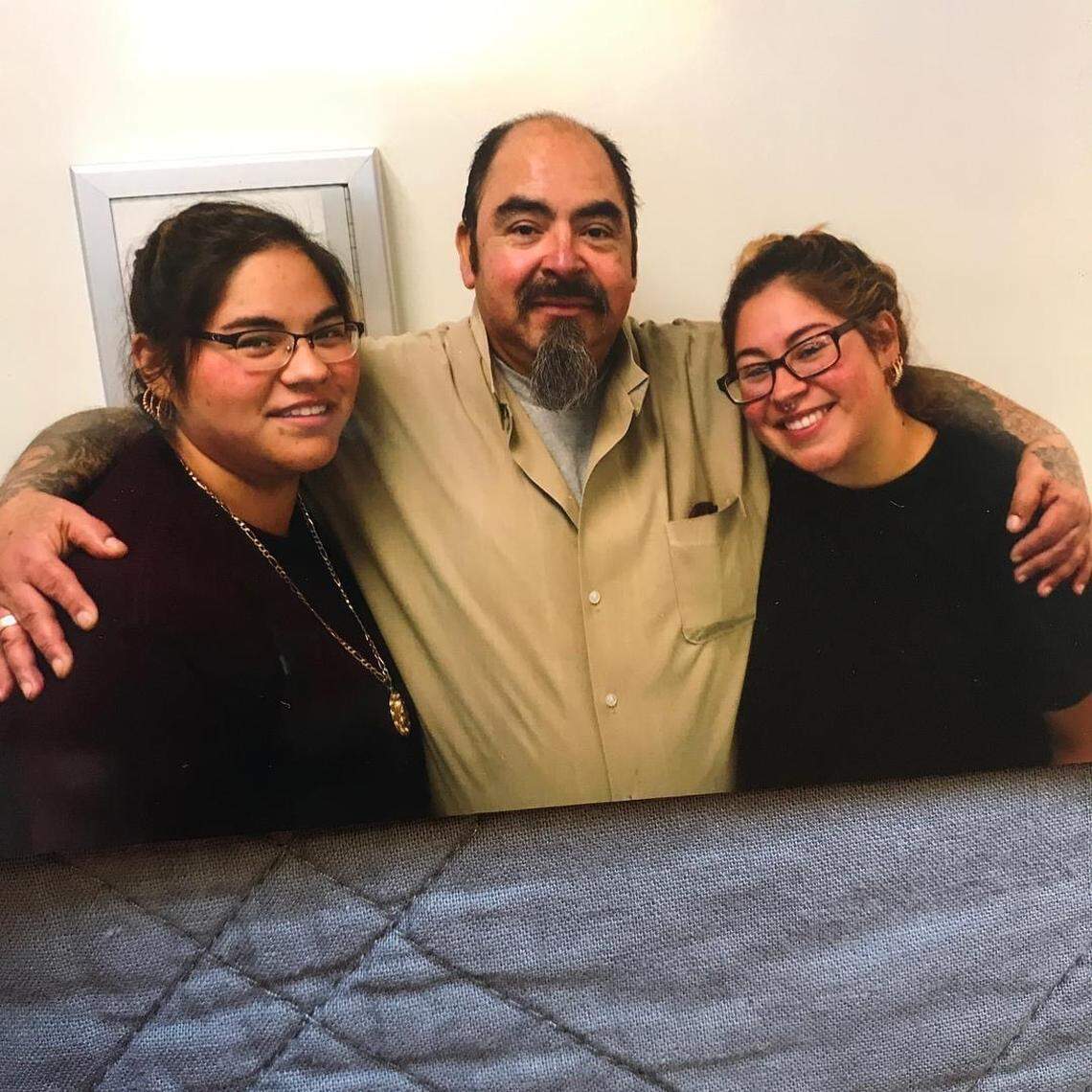Guadalupe Ramos, 56, (center) died from coronavirus on Sunday, May 10 after testing positive at FMC Fort Worth prison. He is pictured here with his two daughters.