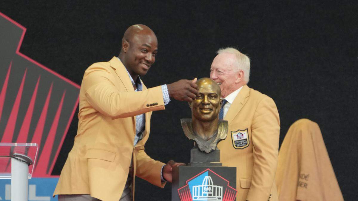 Aug 5, 2023; Canton, OH, USA; Dallas Cowboys and Denver Broncos former linebacker DeMarcus Ware unveils his bust with presenter Jerry Jones during the 2023 Pro Football Hall of Fame Enshrinement at Tom Benson Hall of Fame Stadium. Mandatory Credit: Kirby Lee-USA TODAY Sports