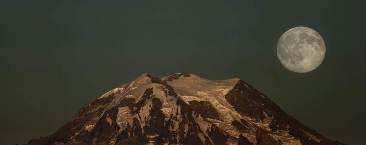 A blue moon rising over Mount Rainier in Washington in 2015.