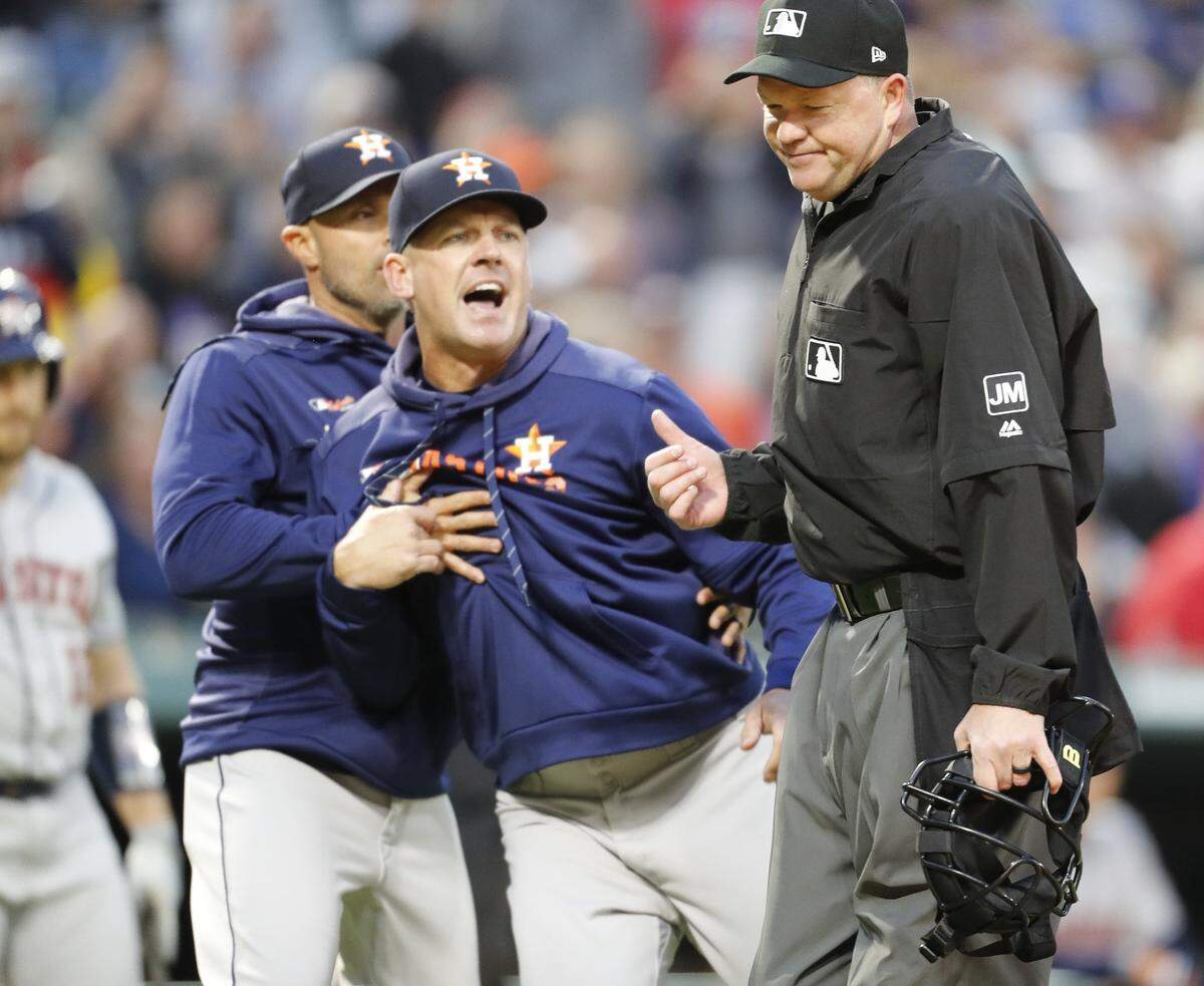 A.J. Hinch had to be restrained Wednesday night by Astros bench coach Joe Espada while arguing with umpire Ron Kulpa.