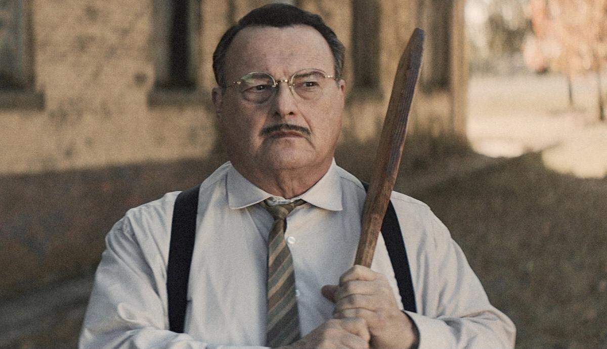 Actor Wayne Knight, known for his role on TV’s “Seinfeld,” plays a sadistic principal in “12 Mighty Orphans.”