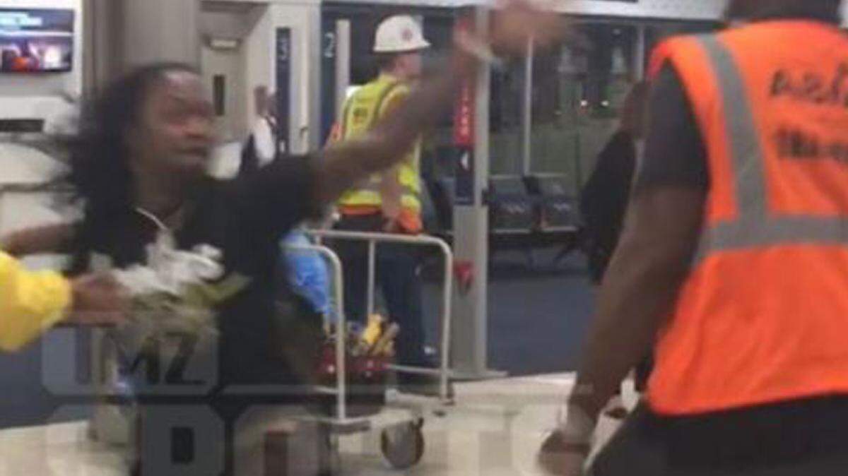Former Cowboys defensive back Adam "Pacman" Jones got in a violent altercation with an employee at Hartsfield-Jackson Atlanta International Airport, video shows.