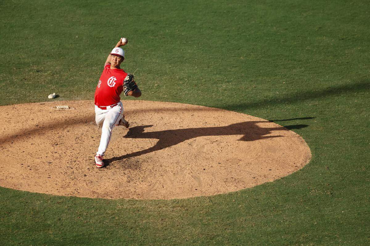 Grapevine pitcher Benjamin Chen throws a pitch, casting a shadow, late in the fifth inning of the Class 5A Division II state championship game against Kingwood Park on Friday, June 6, 2025 at Dell Diamond in Round Rock, Texas. Chen earned MVP honors allowing one hit and no runs in four innings of relief.