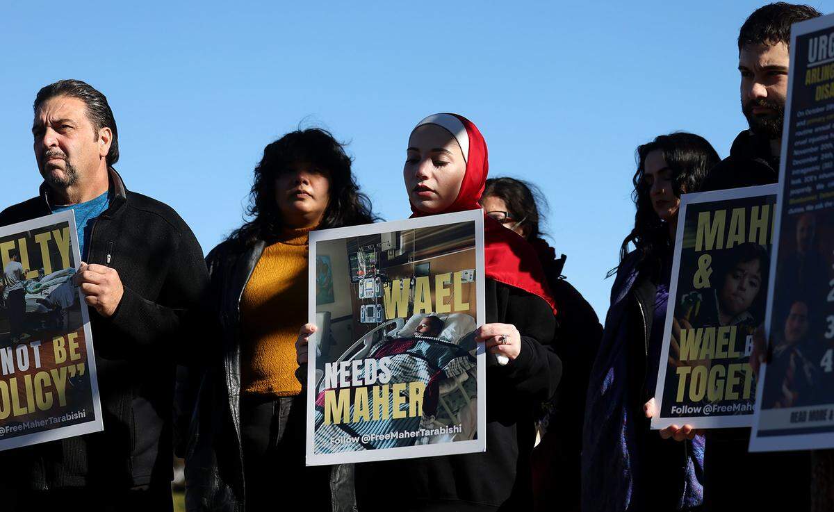 Shahd Arnaout, center, stands with family and community organizers gathered at a press conference on Tuesday, Dec. 30, 2025, to call for the release of Maher Tarabishi, her father-in-law, from Bluebonnet Detention Center on humanitarian grounds. Tarabishi is the primary caregiver for son, Wael, who is living with advanced Pompe Disease which requires 24-hour care.
