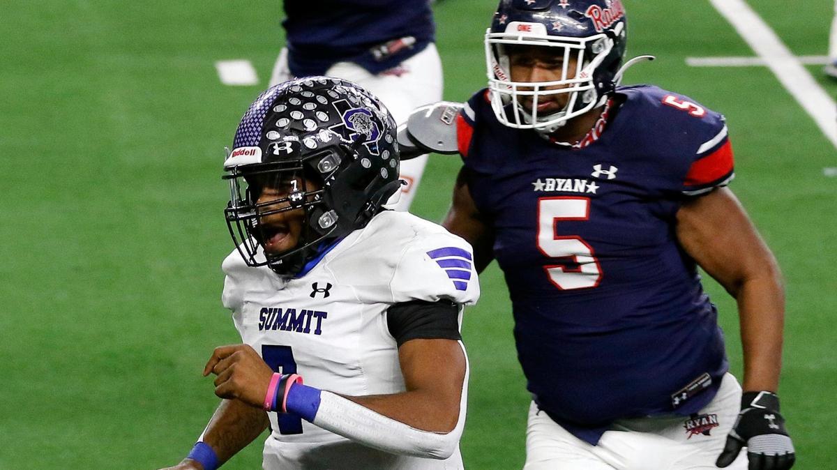 Summit quarterback David Hopkins (7) leads Denton Ryan defensive tackle Mason Davis (5) to the end zone for the Jaguars second touchdown during the Conference 5A Division 1 2020 state championship semi-final football game at AT&T Stadium in Arlington, Texas, Friday, Jan. 08, 2021. Ryan led Summit 21-13 at the half. (Special to the Star-Telegram Bob Booth)
