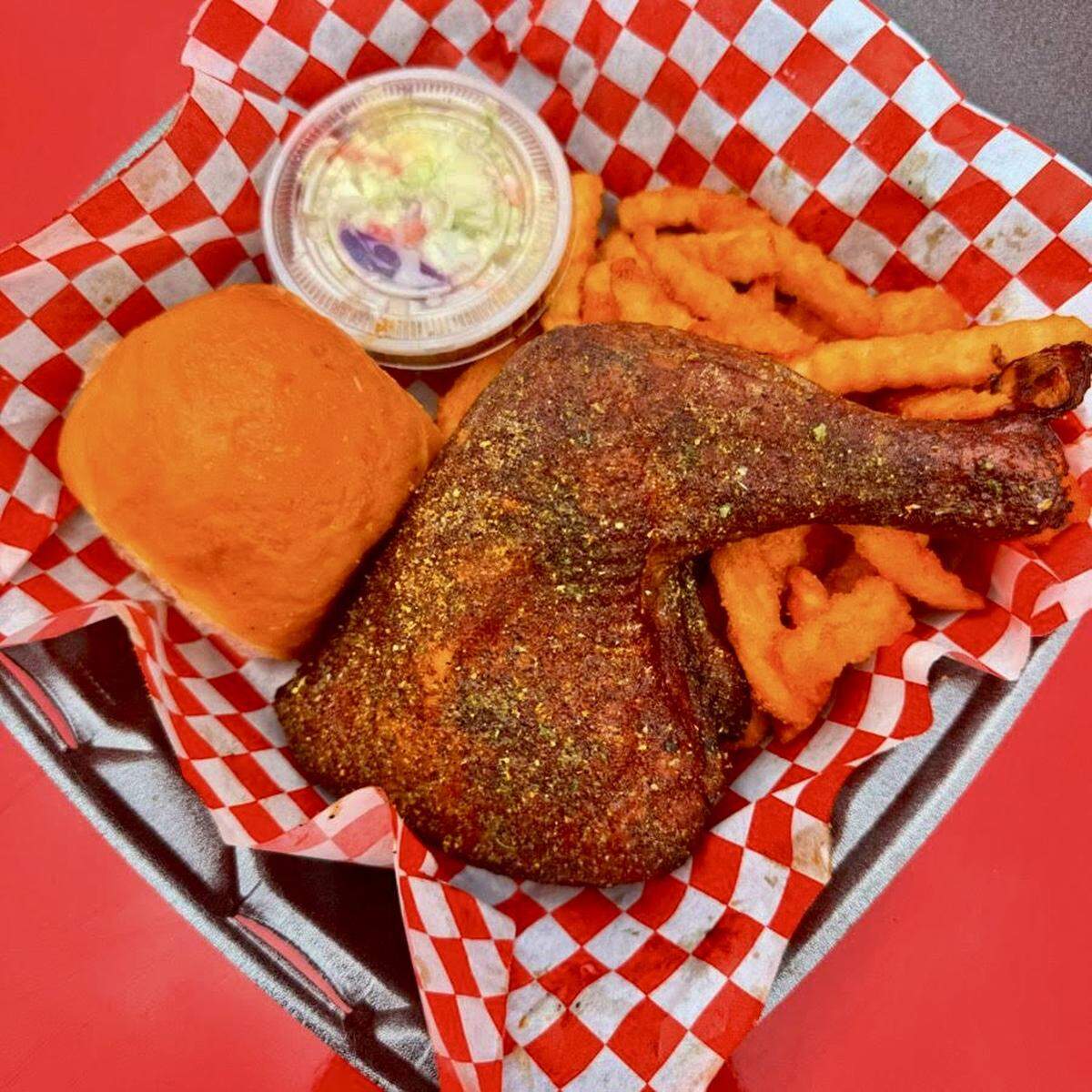 A lemon-pepper rub chicken thigh and leg ar Ribbee’s in Fort Worth.