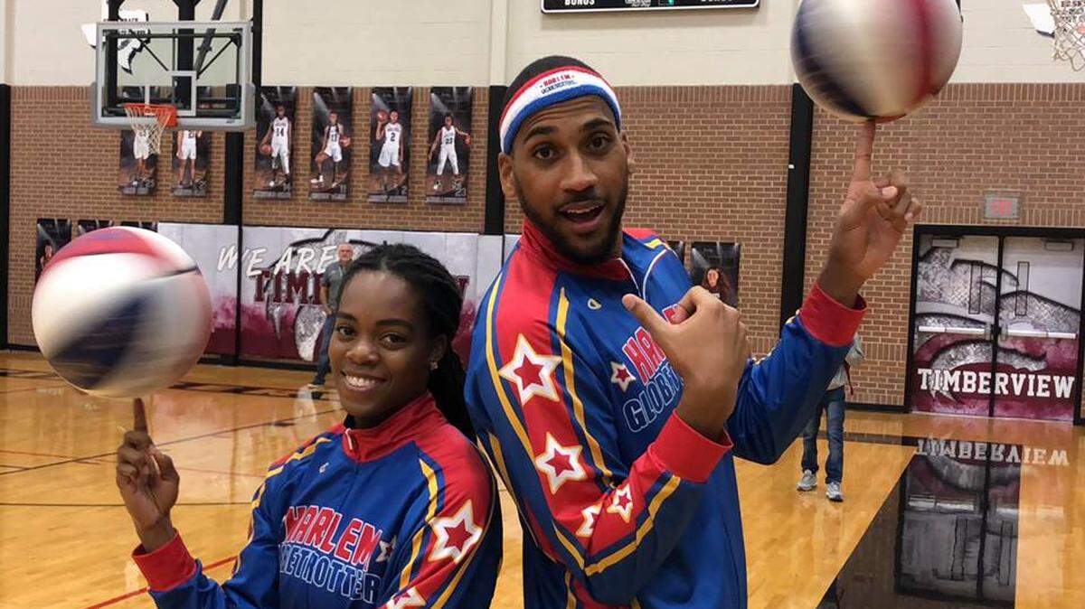 Timberview’s Lili Thompson left and Harlem Globetrotters’ teammate Zeus McClurkin