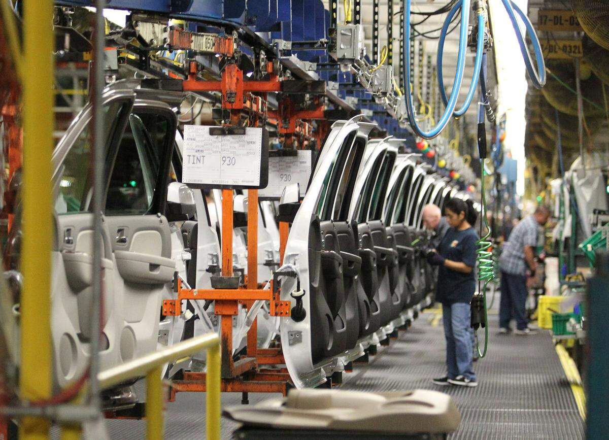 June 12, 2012: Workers on the assembly line at GM Arlington Assembly.