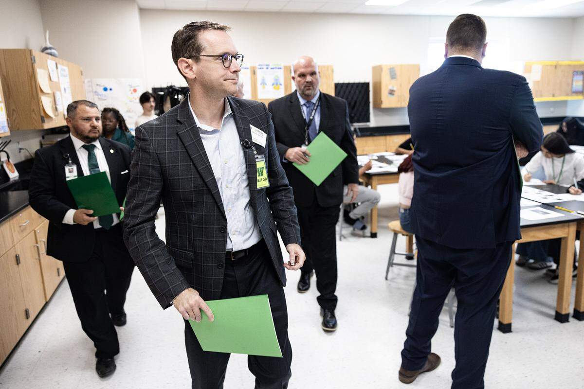 Mike Morath, the Texas Commissioner of Education, walks through a science class at Lucyle Collins Middle School in Lake Worth on Tuesday, Oct. 21, 2025.