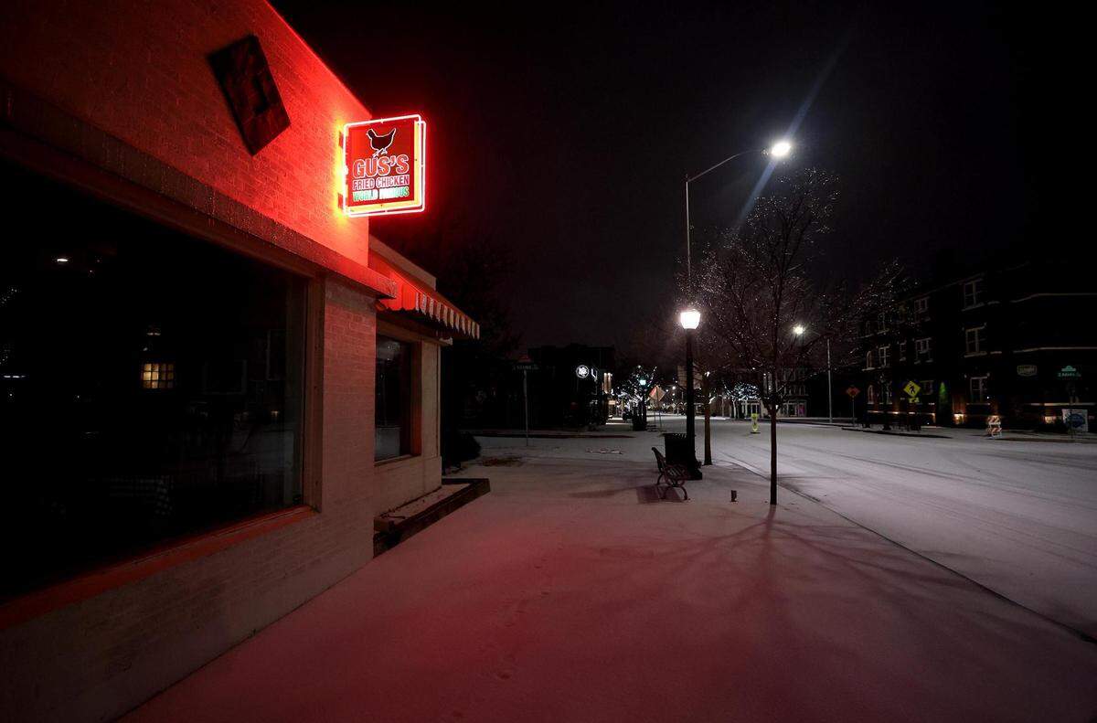 Snow covers the roads in the Fairmount neighborhood of Fort Worth before the sun rises on Thursday, February 3, 2022. North Texas is under a winter weather warning until 6 p.m. Thursday, but icy conditions may not begin to improve until Friday or later in the weekend.