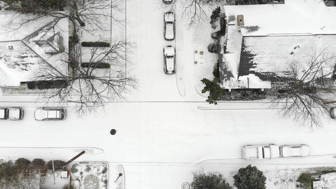 A layer of snow coats the ground in the Fairmount neighborhood of Fort Worth on Feb. 14, 2021.