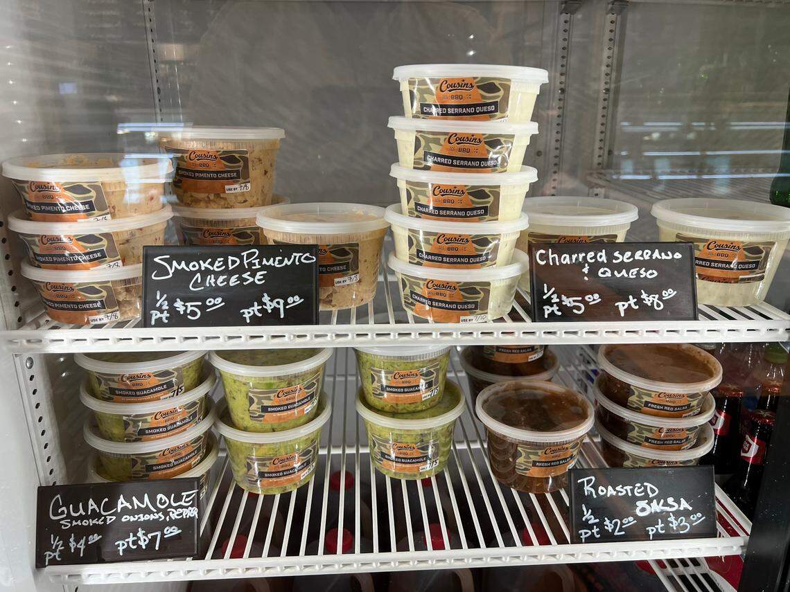 Cousins BBQ offers a grab-and-go case with smoked pimiento cheese, serrano queso, salsa and guacamole.