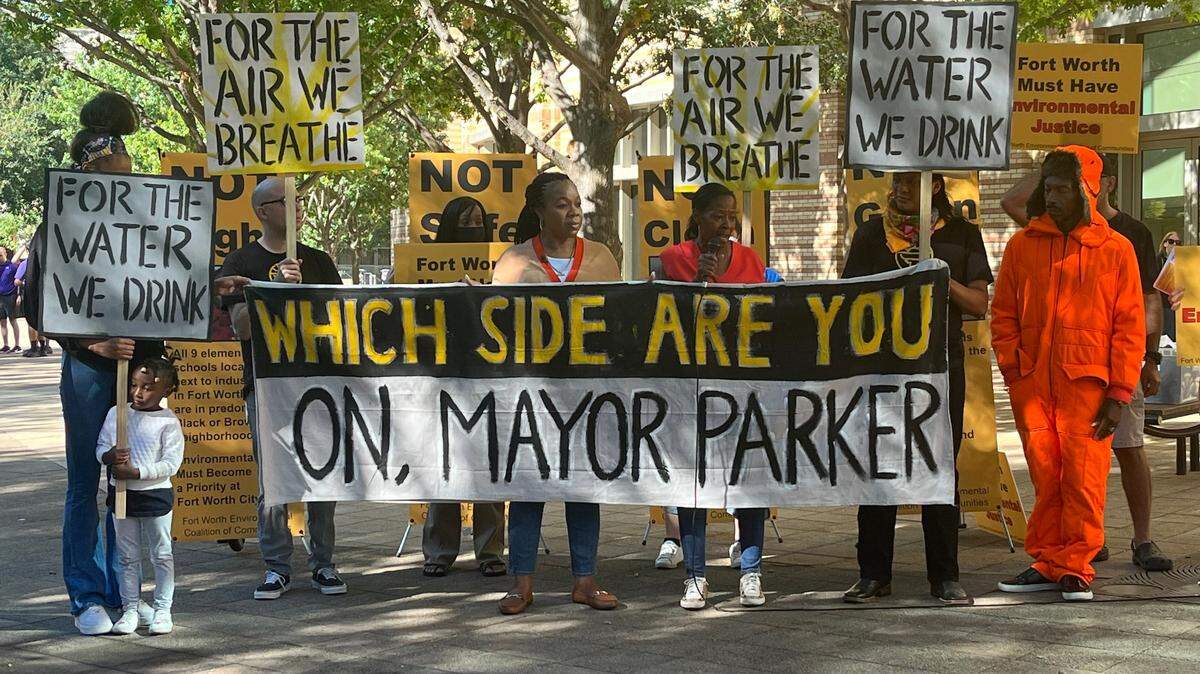 Members of the Fort Worth Environmental Coalition of Communities protested outside of the Fort Worth Convention Center before the State of the City address to protest environmental racism in their communities. 