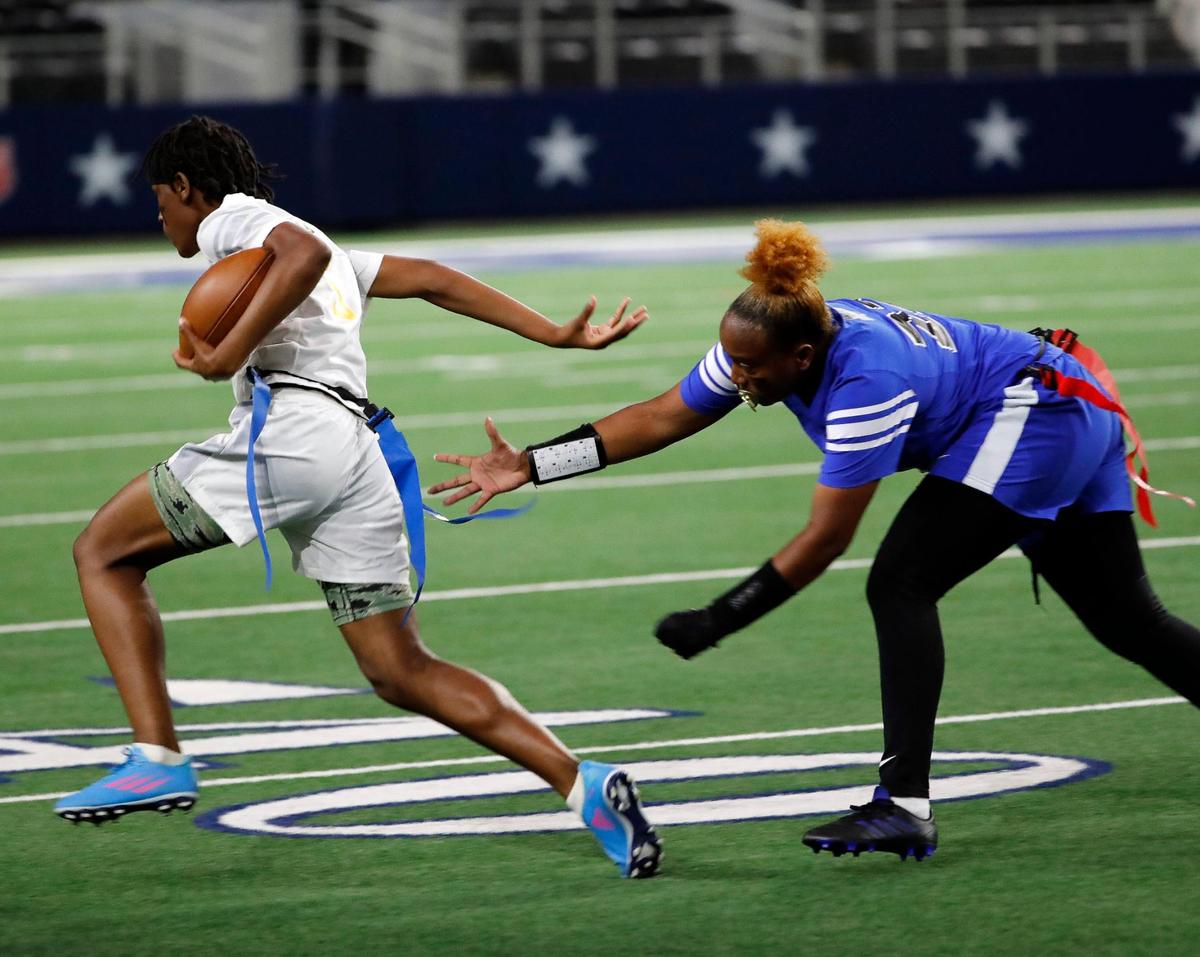 Eastern Hills Rian Guy attempts to gather the flag of Arlington Heights runner Zakari Kilgore during the Fort Worth ISD championship flag football game at ATT Stadium in Arlington, Texas, Wednesday, May 18, 2022. Arlington Heights defeated Eastern Hills . (Special to the Star-Telegram Bob Booth)