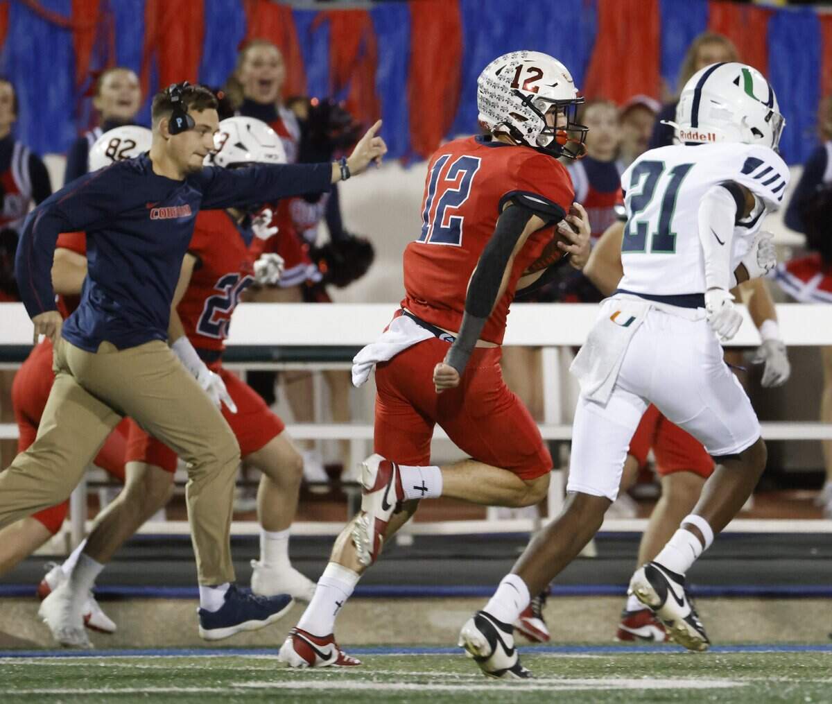 Country Day wide receiver Canaan Factor (12) outruns Oakridge cornerback Dee Robinson (21) down the sidelines during the first half of the SPC 2025 3A Football Championship football game between The Oakridge School and Fort Worth Country Day at Mavericks Stadium in Arlington, Texas, Saturday Nov. 08, 2025.