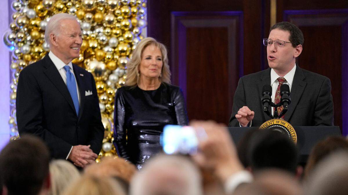 Rabbi Charlie Cytron-Walker speaks as President Joe Biden and first lady Jill Biden listen during a Hanukkah holiday reception in the Grand Foyer of the White House in Washington on Monday, Dec. 19, 2022.