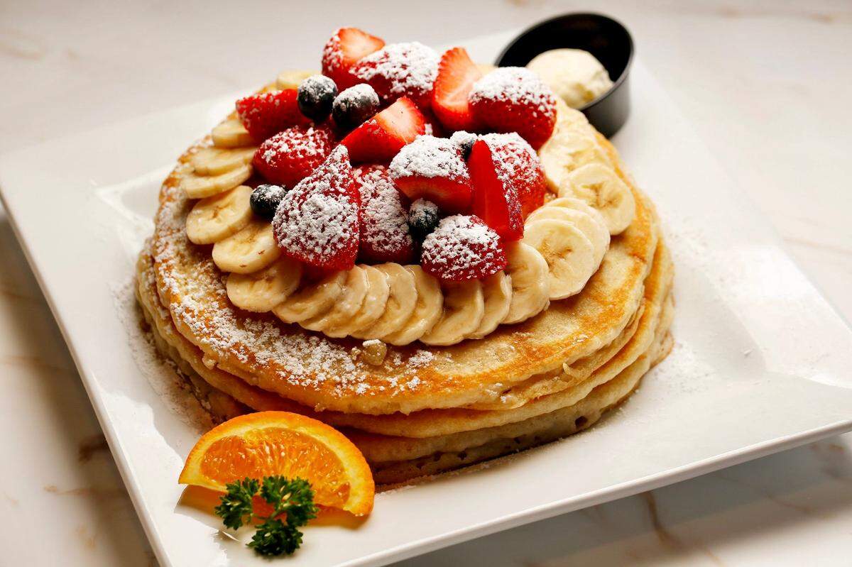 “Florida pancakes” at Keke’s Breakfast Cafe with fresh strawberries, banana, blueberries and powdered sugar, as seen February 27, 2024, in Jacksonville. Florida.