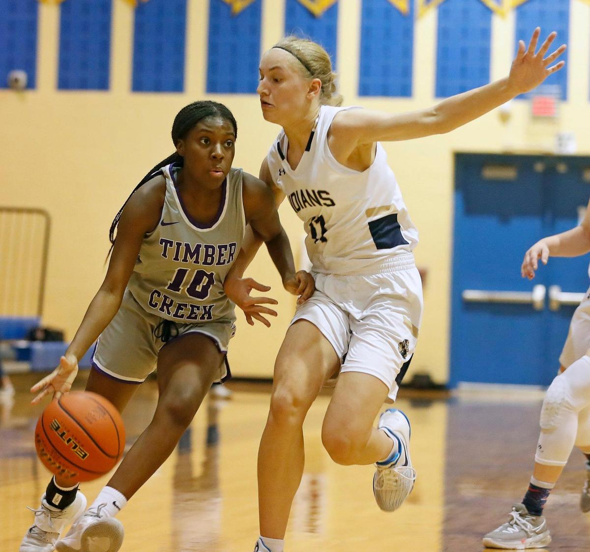 Timber Creek guard Mackenzee Jones (10) attempts to outrun Keller guard Renee Chmiel (11) to the corner in the first half of a 4-6A district high school girls basketball game at Keller High School in Keller, Texas, Thursday, Jan. 28, 2021. Timber Creek led 28-27 at the half. (Special to the Star-Telegram Bob Booth)