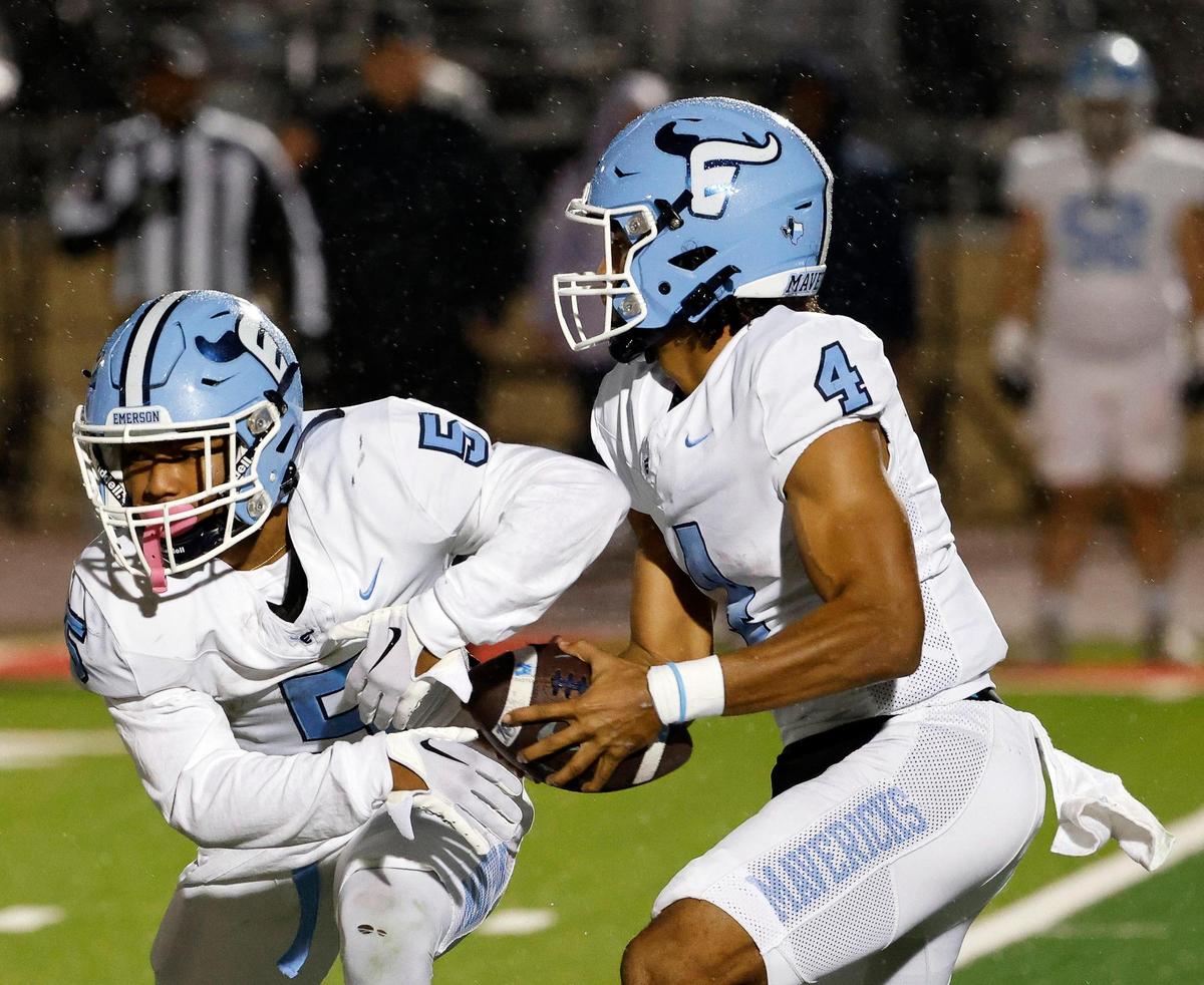 Emerson quarterback Michael Hawkins (4) pulls away from running back Ishaqq Bills (5) for a keeper in the first half of a UIL 5A D2 football playoff game at Mustang Panther Stadium in Grapevine, Texas, Thursday, Nov. 09, 2023.