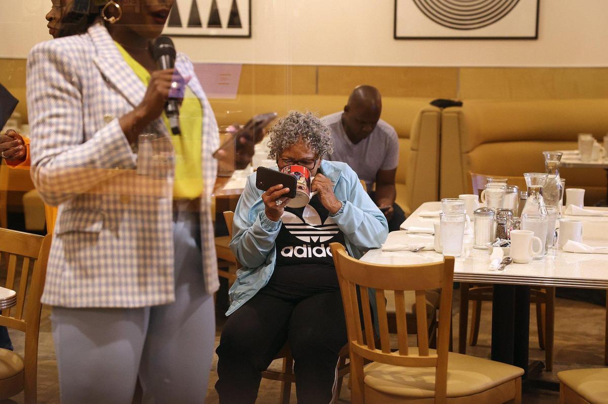 Civil rights activist Opal Lee sneaks a drink of coffee between hugs and photos during a watch party for the announcement of the 2022 Nobel Peace Prize winners on Friday, October 7, 2022, at Paris Coffee Shop in Fort Worth. Lee, regarded as the grandmother of Juneteenth, was nominated but did not receive the Nobel Peace Prize.