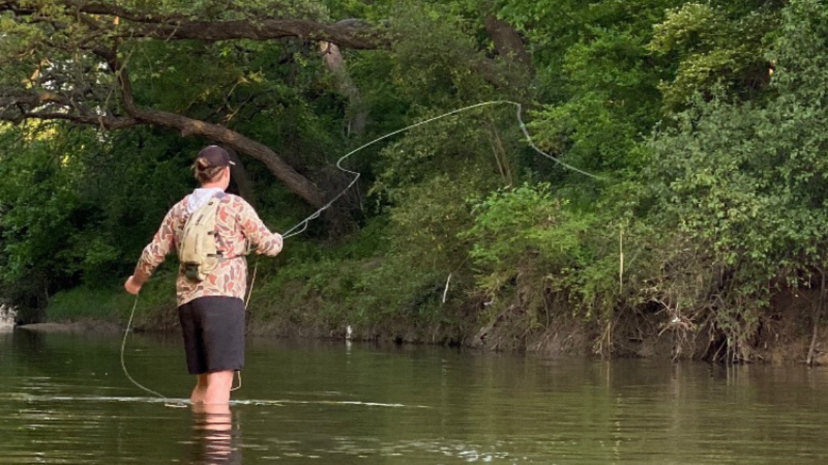 A man fishes in Mary’s Creek in this 2020 photo. Benbrook residents fear a new development in the creek’s existing floodplain will result in greater flood risks for nearby homes.