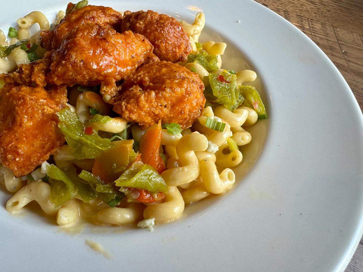 Buffalo chicken with green-chile mac-and-cheese at Anchor Bar Restaurant Sept. 17, 2024.