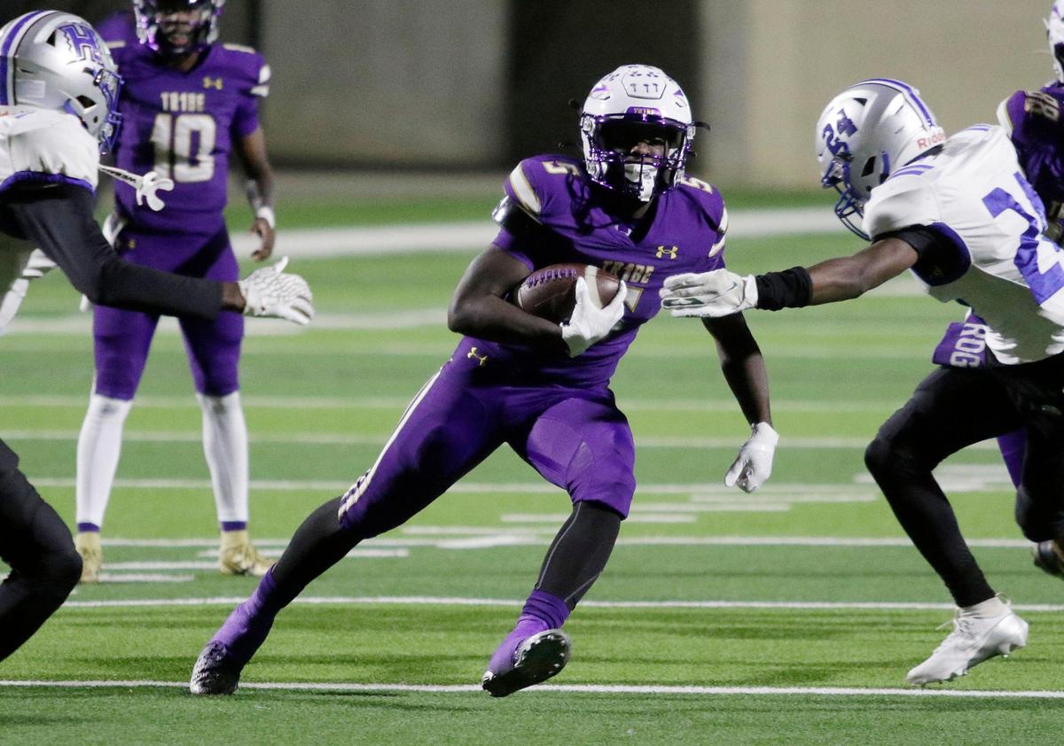 Alvarado’s Demarcus Belton runs though a hole in the Eastern Hills defense during a UIL football playoff game at Crowley ISD Multi Purpose Stadium on Friday November 8, 2024.