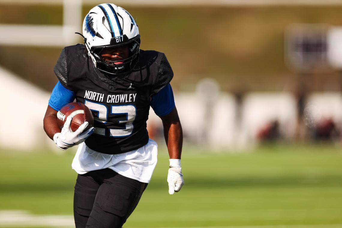 North Crowley running back Kiante Ingram (23) runs with the ball toward the end zone against Coppell in a Class 6A Division I regional playoff Saturday, Nov. 29, 2025, at Midlothian ISD Stadium in Midlothian.