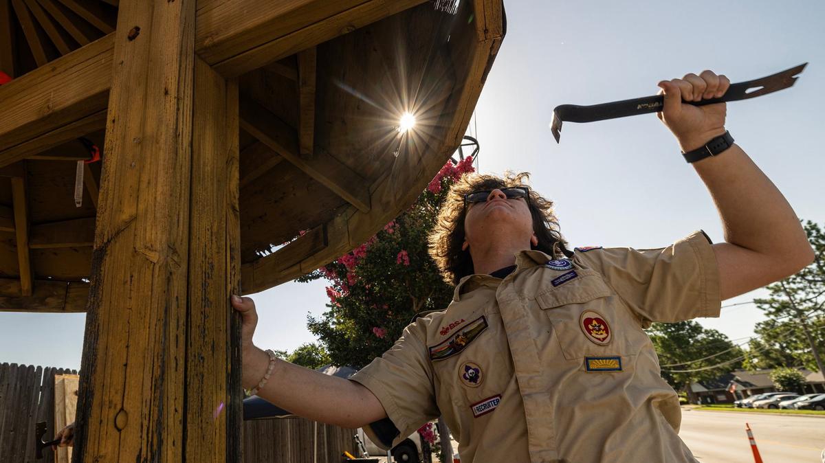 Boy Scout Reese Hughes begins to take off the nails in the Bedford Well roof shingles for his Eagle Scout restoration project in Bedford on Saturday. Hughes chose to repair a well that is significant in Bedford’s history as the city’s founder built it as a rest stop for travelers going from Grapevine to Fort Worth.