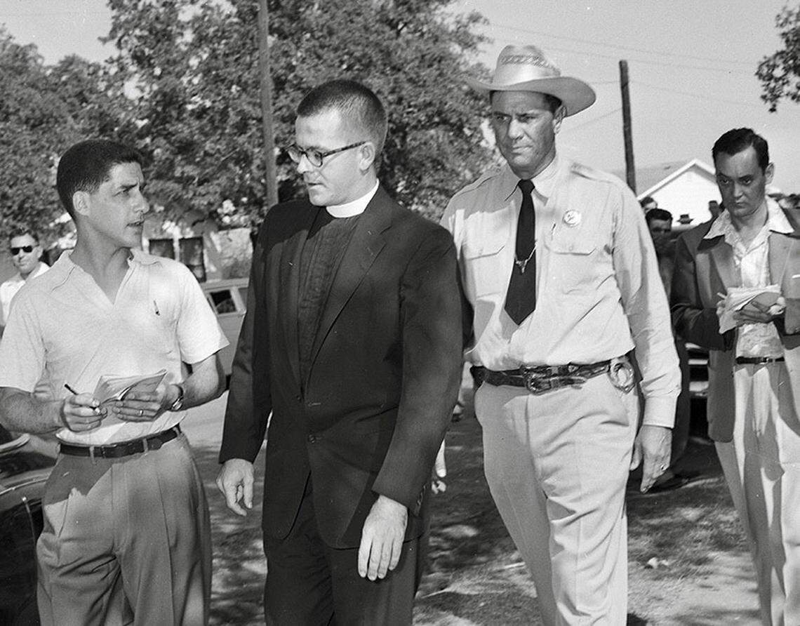 Rev. D.W. Clark of St. Timothy’s Episcopal Church is escorted away from the mob at Mansfield High School after he was shoved Sept. 4, 1956, during the Mansfield school desegregation incident. Texas Ranger E.J. Banks of Dallas is escorting Clark.