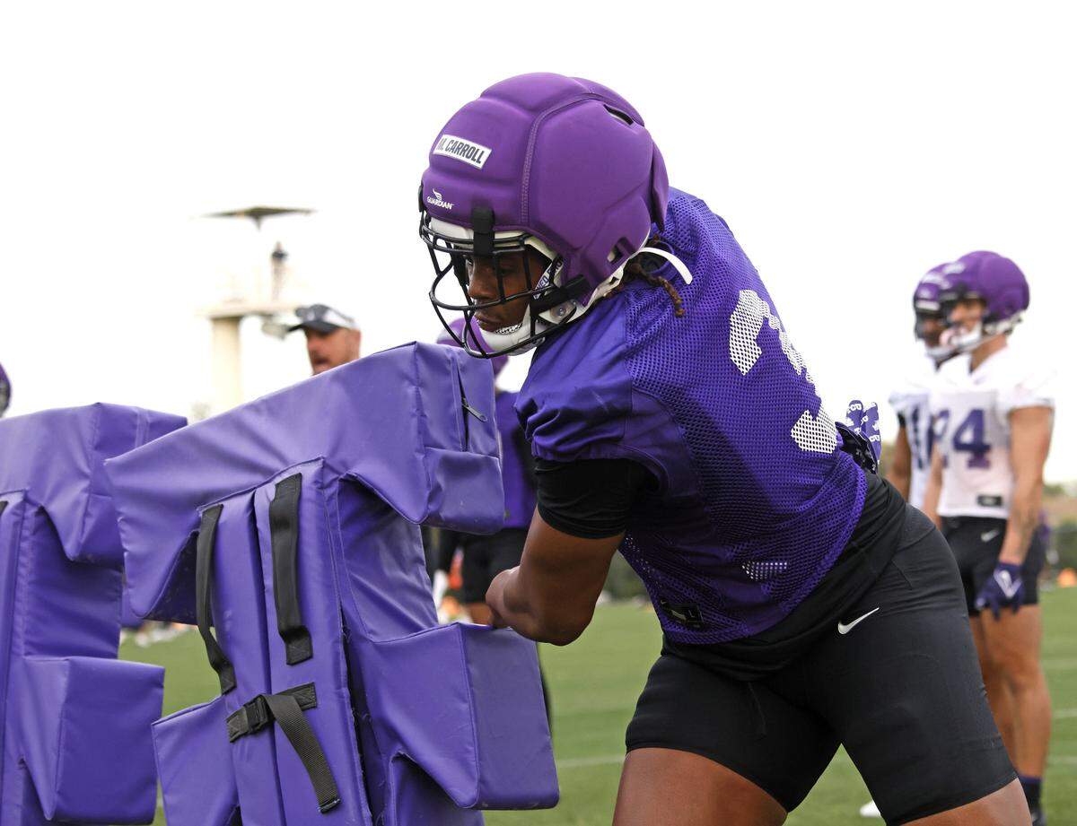 TCU linebacker Max Carroll hits the sled during the first day of Spring football practice at TCU in Fort Worth, Texas, Tuesday, March 24, 2026.