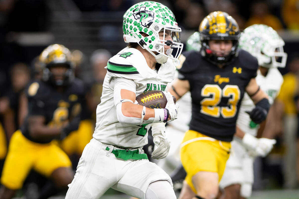 Paradise’s Cash Watson (4) looks for room to run against Malakoff in a Class 3A Division 1 state quarterfinal on Thursday, Dec. 12, 2024 at the Ford Center in Frisco, Texas.