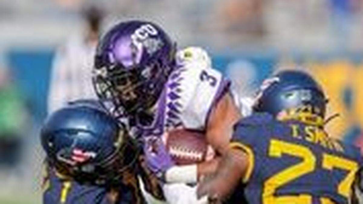 TCU running back Emari Demercado runs the ball against West Virginia’s defense earlier this month.