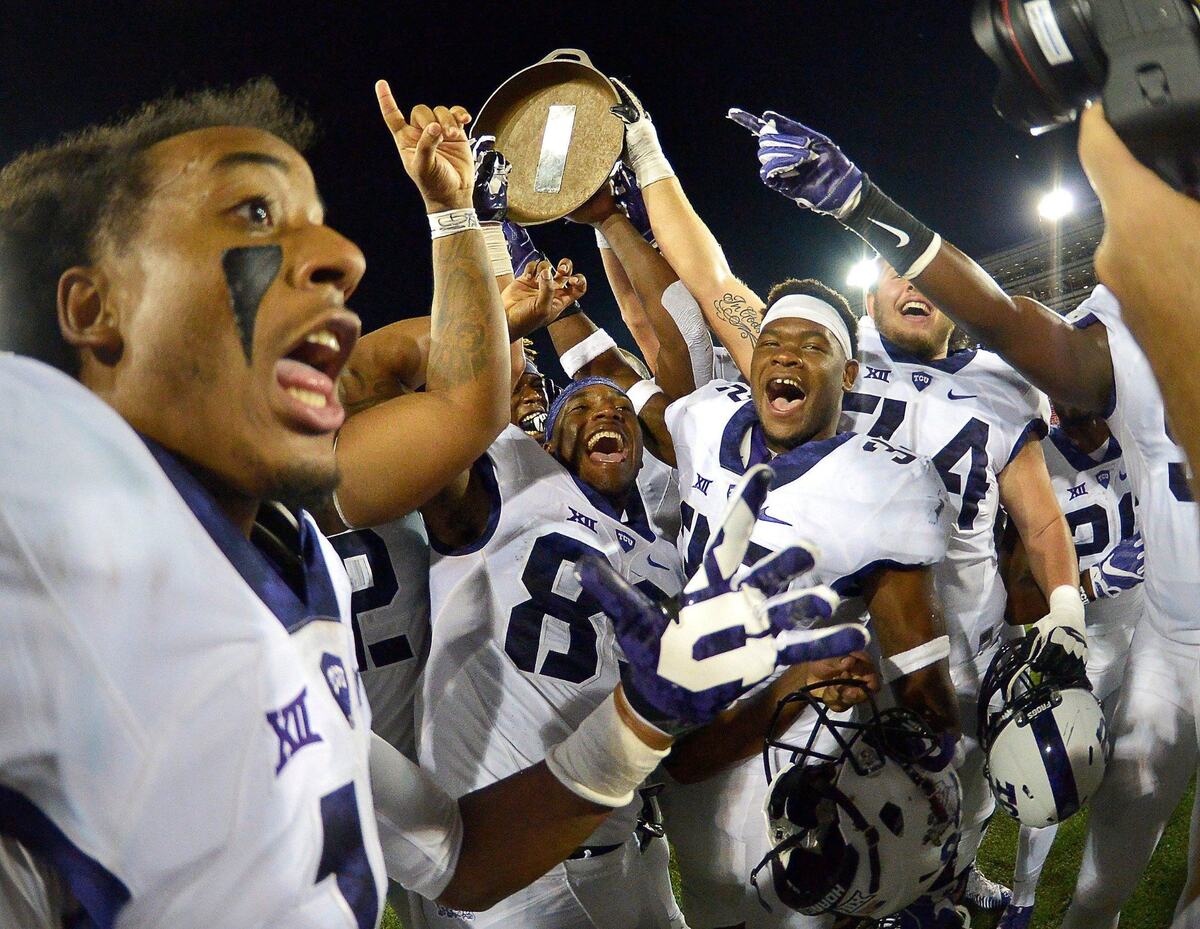 TCU Horned Frogs celebrating retaining the Iron Skillet as TCU beat SMU 33 - 3 in college football at Gerald J. Ford Stadium in Dallas, TX, Friday, Sept. 23, 2016.