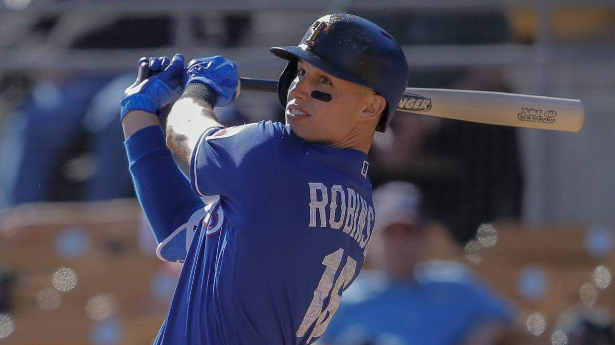 Texas Rangers outfielder Drew Robinson (18) doubles in the eighth inning as the Chicago White Sox beat the Texas Rangers 5-4 at Glendale, Arizona in spring training, Wednesday, February 28, 2018.