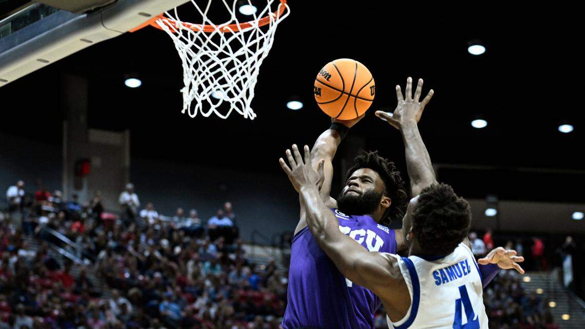 TCU guard Mike Miles Jr., left, dunks above Seton Hall forward Tyrese Samuel (4) during the first half of a first-round NCAA college basketball tournament game, Friday, March 18, 2022, in San Diego. (AP Photo/Denis Poroy)