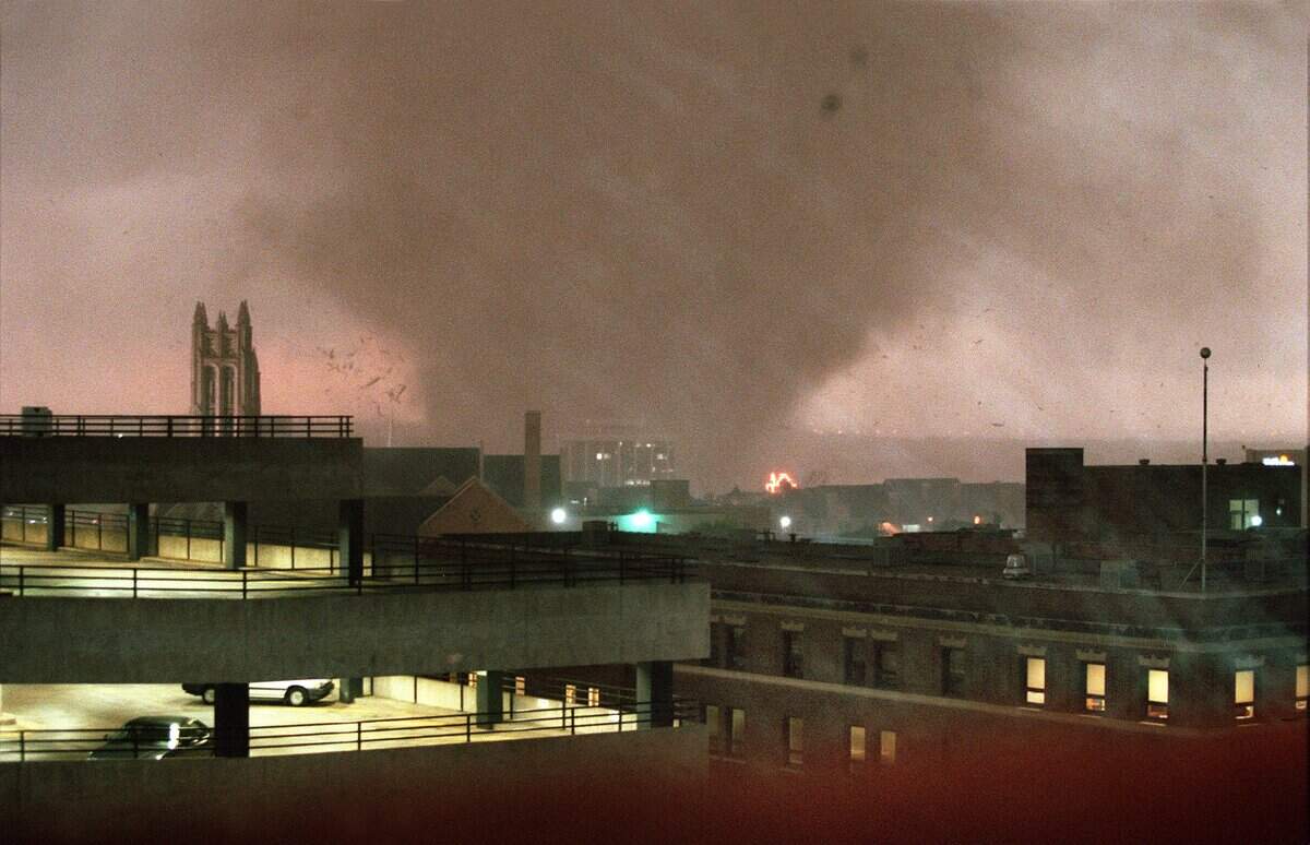 A tornado crosses the Trinity River on the west side of Fort Worth and heads for downtown. The Mallick Tower is pictured just at the base of the tornado.