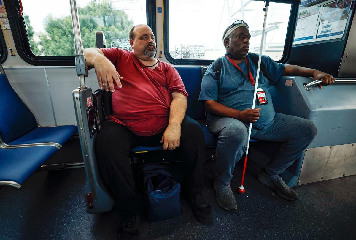 Billy Patton and Marcus Johnson ride a Trinity Metro bus to Fort Worth Central Station while commuting home after a day of working at Lighthouse for the Blind on Wednesday, May 22, 2024.