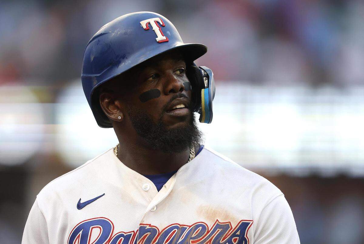 Texas Rangers center fielder Adolis García walks off the field following the Ranger’s 6-4 loss to the Colorado Rockies on Monday, April 11, 2022, at Globe Life Field.