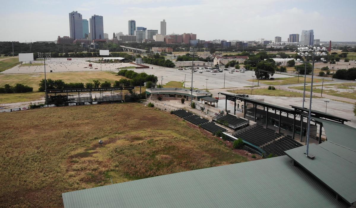 A 2018 photo shows brown grass and empty bleachers at LaGrave Field.