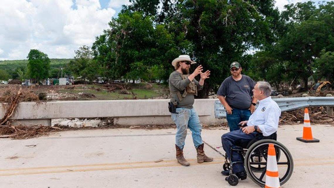 Gov. Greg Abbott tours flood damage in Leander, Texas, on Monday, July 14, 2025.