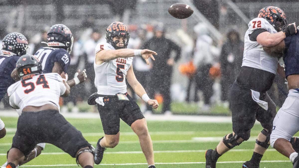 Aledo quarterback Gavin Beard (5) throws the ball in the rain against Denton Ryan in a Class 5A Division 1 state quarterfinal on Saturday, Dec. 7, 2024 at Crowley ISD Multi-Purpose Stadium in Fort Worth, Texas.