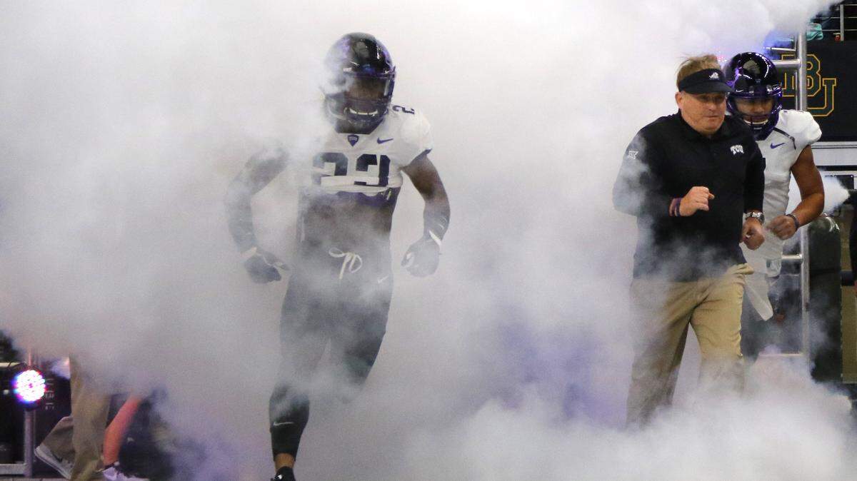 TCU head coach Gary Patterson leads the team out of the tunnel before the Big 12 championship game against Oklahoma at AT&T Stadium in Arlington on Dec. 2.