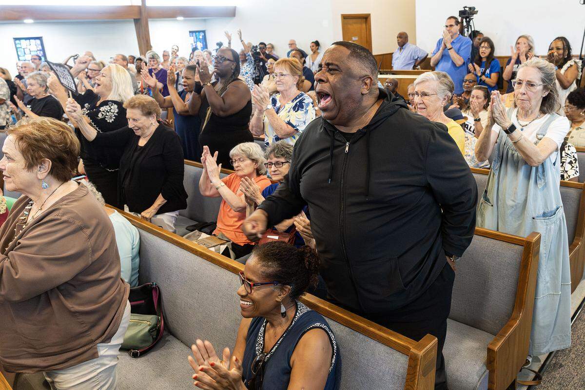 Rally attendees react to Tarrant County Commissioner Roderick Miles speaking on stage for the “Build The Backlash” rally at greater St. Stephen First Church in Fort Worth on Wednesday, Aug. 6, 2024. The rally called out the efforts of Texas republicans to gerrymander the state and silence Black voters.