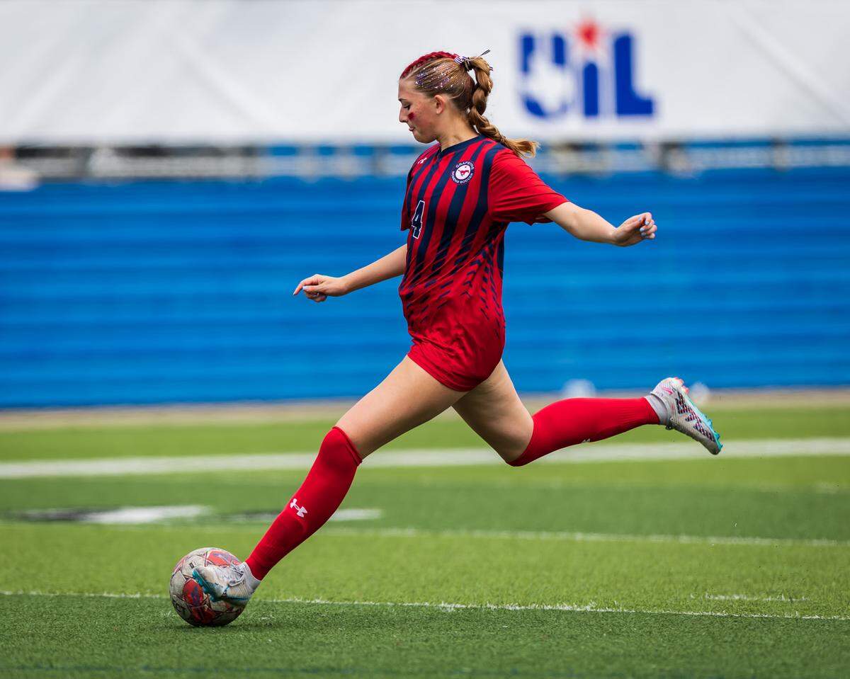 Grapevine’s Lillian Cooper (4) approaches the ball for a kick against Montgomery Lake Creek in the UIL Class 5A Division II state soccer championship game on Friday, April 10, 2026, at Birkelbach Field in Georgetown, Texas.